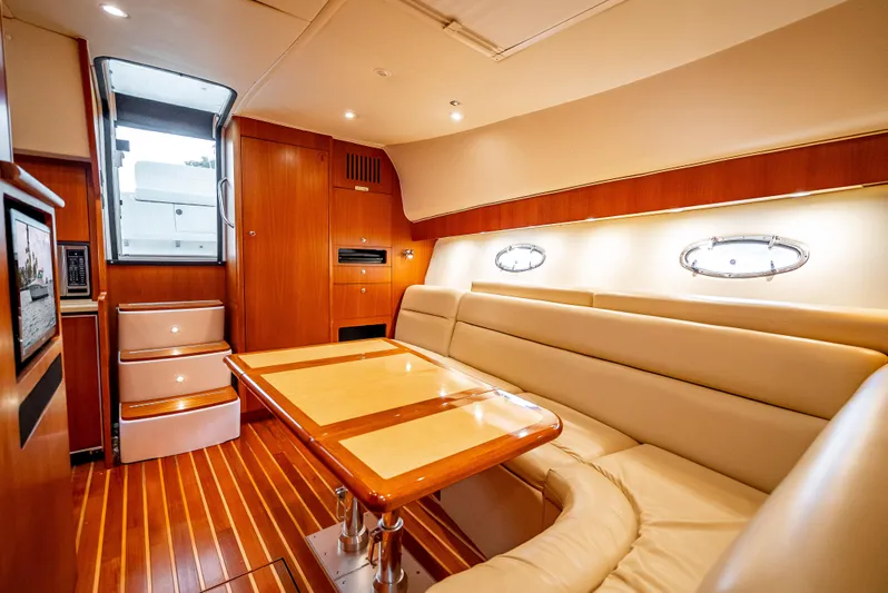  Yacht Photos Pics 2005 Tiara Yachts 4200 Open interior with elegant wood finish and plush seating.