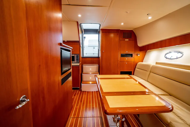  Yacht Photos Pics 2005 Tiara Yachts 4200 Open interior with wood finish, dining area, and modern amenities.