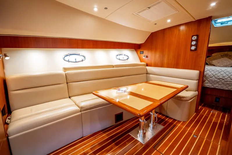  Yacht Photos Pics Luxurious interior of 2005 Tiara Yachts 4200 Open with elegant seating and wooden accents.