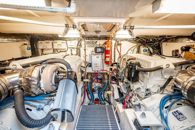  Yacht Photos Pics Engine room of 2005 Tiara Yachts 4200 Open, showcasing dual engines and mechanical systems.