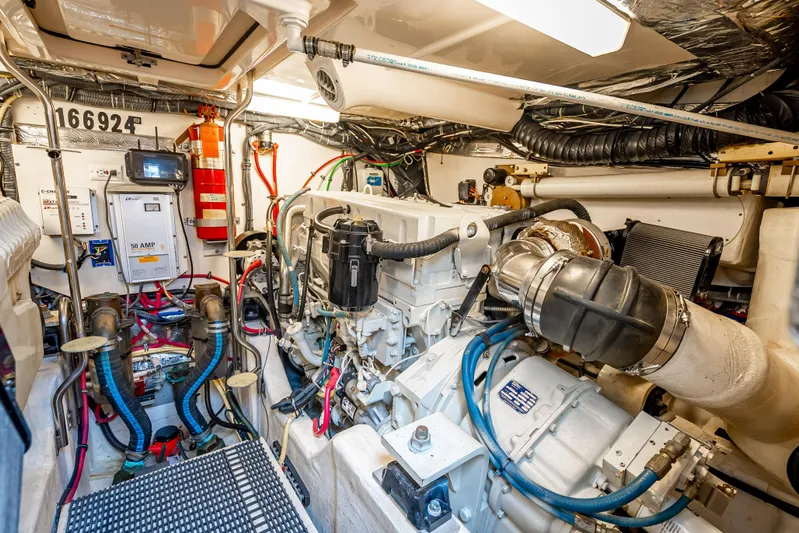  Yacht Photos Pics Engine room of a 2005 Tiara Yachts 4200 Open, showcasing mechanical components and wiring.