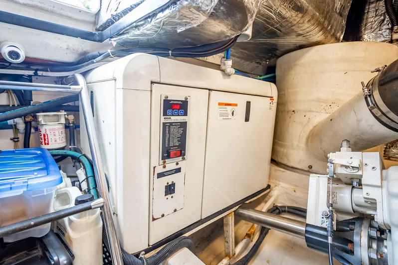  Yacht Photos Pics Engine room of 2005 Tiara Yachts 4200 Open, featuring control panel and machinery.