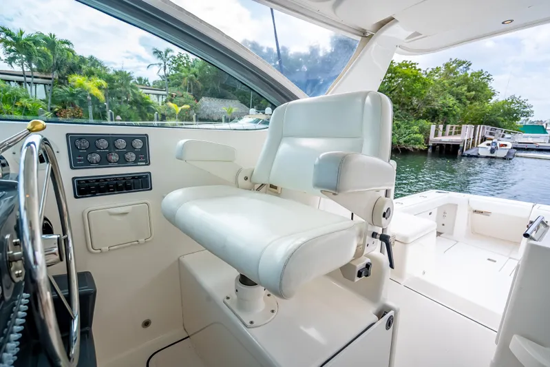  Yacht Photos Pics Captain's chair on 2005 Tiara Yachts 4200 Open, overlooking serene marina view.