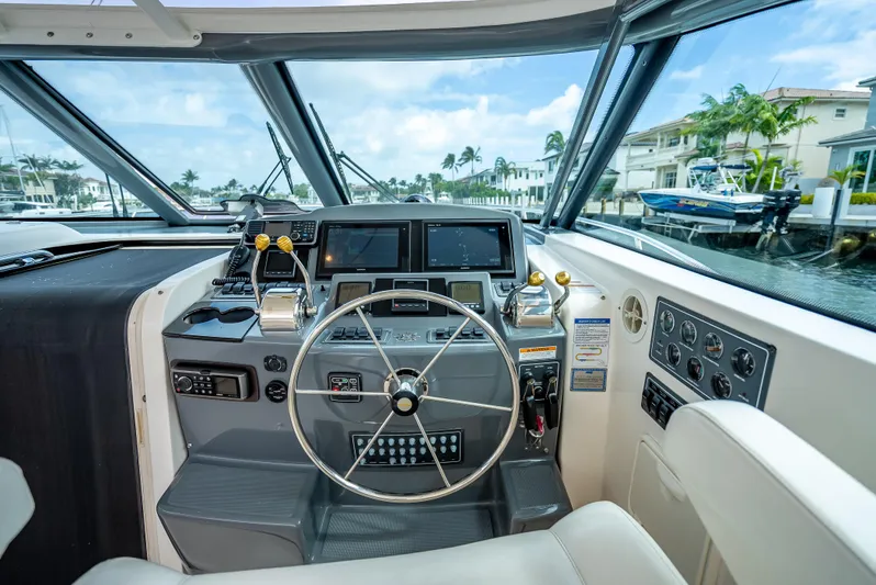  Yacht Photos Pics 2005 Tiara Yachts 4200 Open helm with modern controls and waterfront view.