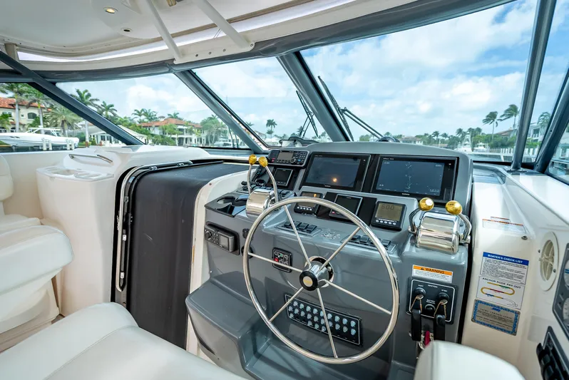  Yacht Photos Pics 2005 Tiara Yachts 4200 Open helm with modern navigation equipment and luxurious seating.