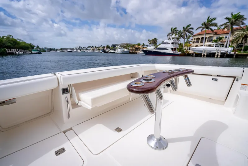  Yacht Photos Pics 2005 Tiara Yachts 4200 Open deck with rod holders, overlooking a scenic waterfront.