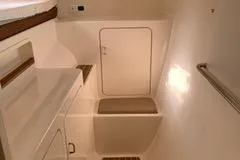 Casuarina Yacht Photos Pics Interior of 2000 Voyage Yachts Norseman 430, featuring a compact, white bathroom space.