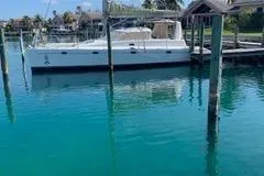 Casuarina Yacht Photos Pics Voyage Yachts Norseman 430, 2000 model, docked in clear blue water.