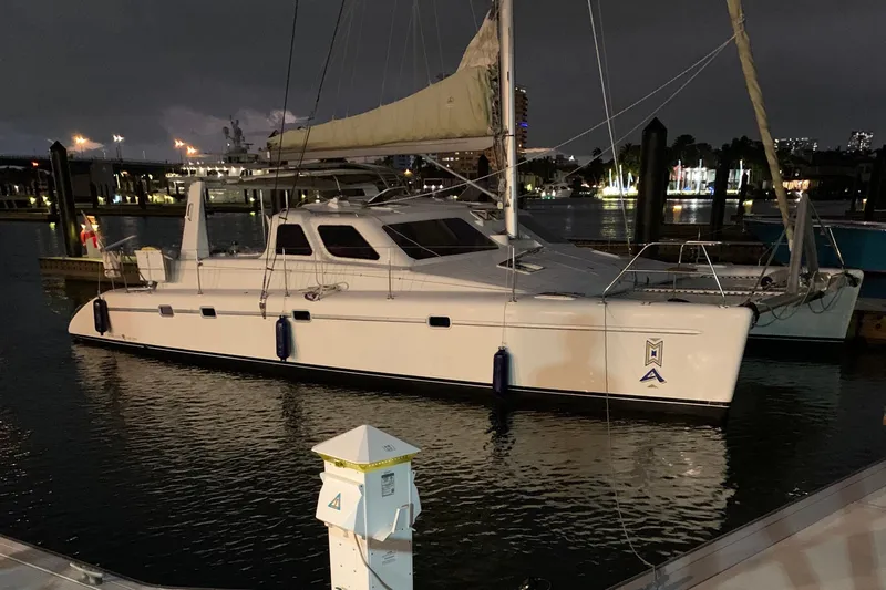 Casuarina Yacht Photos Pics Voyage Yachts Norseman 430 catamaran docked at night, 2000 model.