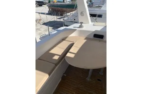 Casuarina Yacht Photos Pics 2000 Voyage Yachts Norseman 430 deck with cushioned seating and table.