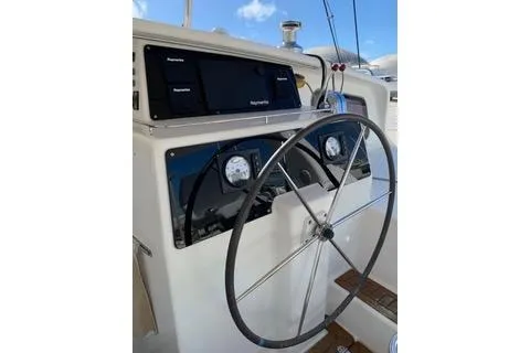 Casuarina Yacht Photos Pics Steering wheel of 2000 Voyage Yachts Norseman 430 with navigation instruments.