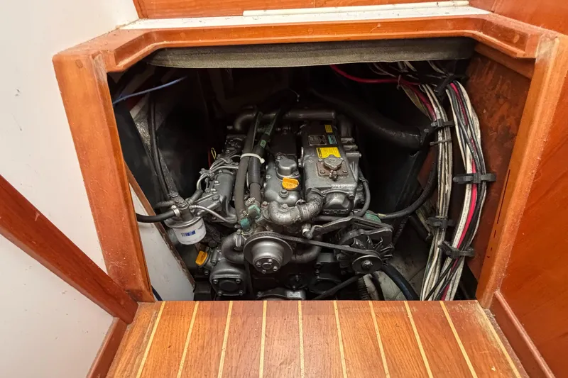 Custom Yacht Photos Pics Engine compartment of a 2000 Sabre 452 boat, showcasing mechanical components and wiring.