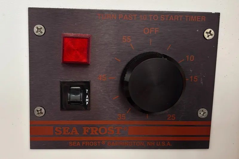 Custom Yacht Photos Pics Control panel for Sea Frost refrigeration system, featuring a timer dial and temperature switch.