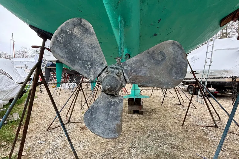 Custom Yacht Photos Pics Propeller of a 2000 Sabre 452 sailboat on dry dock, showing wear and patina.