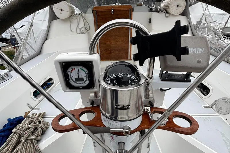 Custom Yacht Photos Pics Steering wheel and navigation instruments on a 2000 Sabre 452 sailboat.