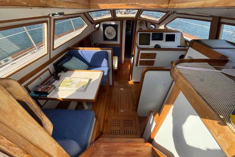 Custom Yacht Photos Pics Interior of 2000 Sabre 452 sailboat with wooden finish and navigation area.