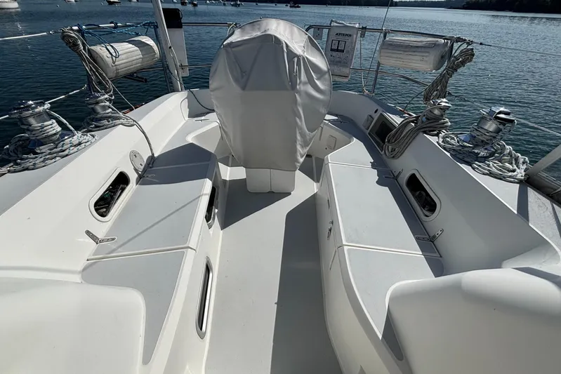 Custom Yacht Photos Pics Sailboat deck of 2000 Sabre 452, featuring winches and ropes, docked on calm water.