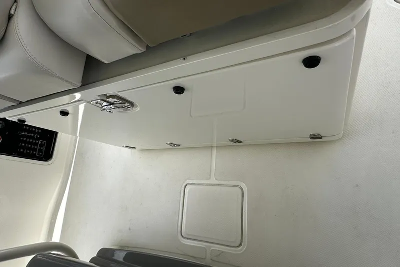  Yacht Photos Pics 2017 Boston Whaler 330 Outrage interior, featuring storage compartment and seating.