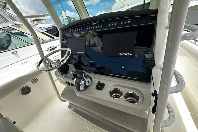  Yacht Photos Pics 2017 Boston Whaler 330 Outrage helm with Raymarine electronics and dual cup holders.