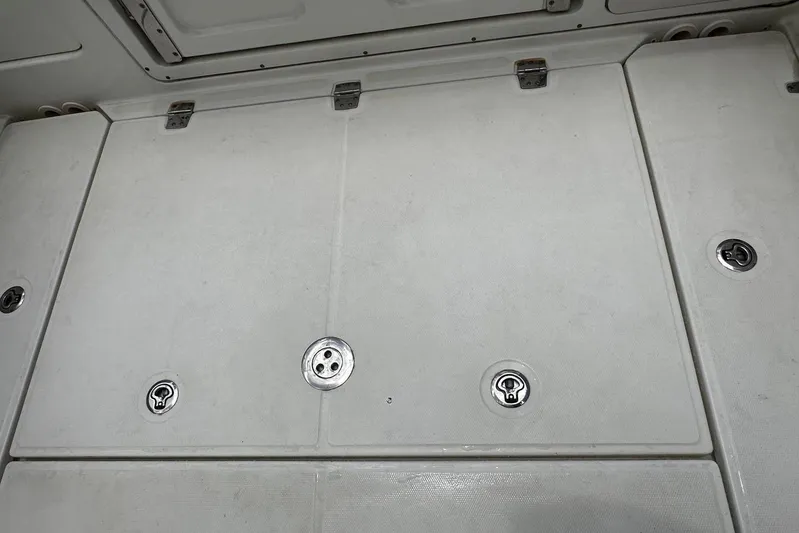  Yacht Photos Pics 2017 Boston Whaler 330 Outrage deck with storage compartments and latches.