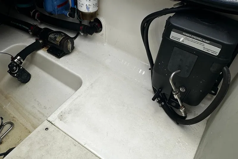  Yacht Photos Pics 2017 Boston Whaler 330 Outrage power steering pump and components in boat compartment.