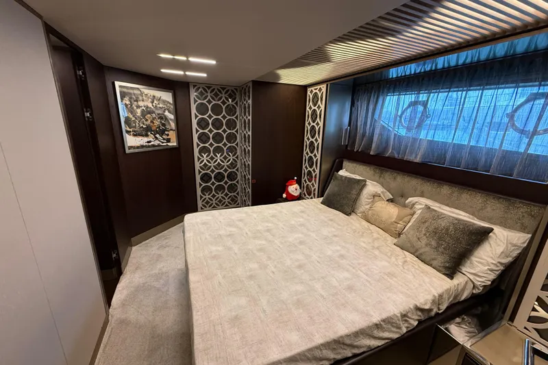 Ferretti 850 Yacht Photos Pics Luxurious bedroom interior on 2017 Ferretti Yachts 850, featuring elegant decor and comfortable bedding.