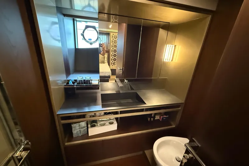 Ferretti 850 Yacht Photos Pics Luxurious bathroom interior of 2017 Ferretti Yachts 850, featuring modern sink and mirror.