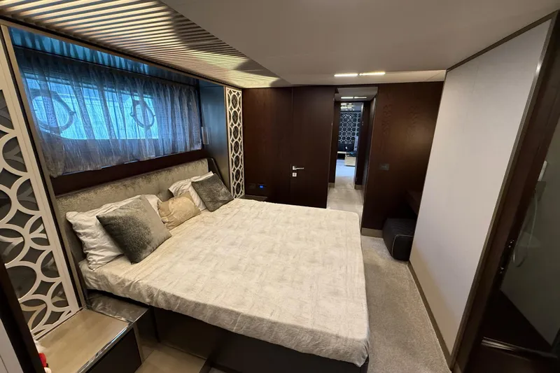 Ferretti 850 Yacht Photos Pics Luxurious bedroom interior of 2017 Ferretti Yachts 850 with elegant decor and comfortable bedding.