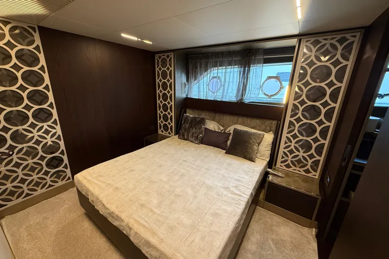 Ferretti 850 Yacht Photos Pics Luxurious bedroom interior of 2017 Ferretti Yachts 850 with elegant decor and bedding.