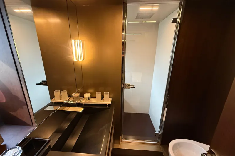 Ferretti 850 Yacht Photos Pics Luxurious bathroom interior of 2017 Ferretti Yachts 850 with modern fixtures and glass shower.