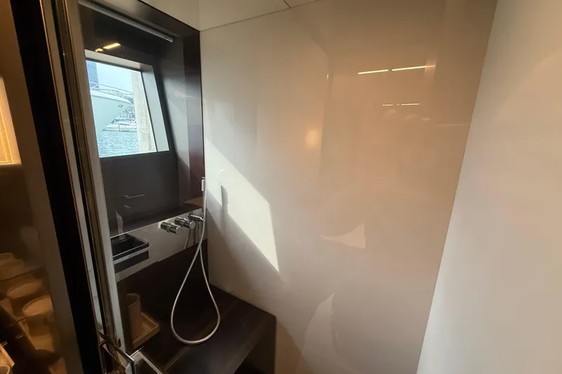 Ferretti 850 Yacht Photos Pics Luxurious bathroom interior on a 2017 Ferretti Yachts 850, featuring modern fixtures and window view.