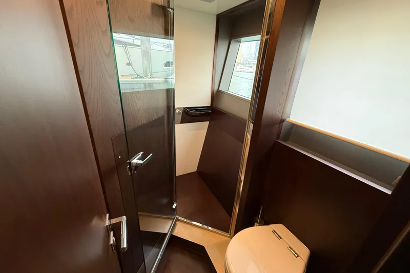 Ferretti 850 Yacht Photos Pics Luxurious bathroom interior of 2017 Ferretti Yachts 850 with modern fixtures and wood accents.