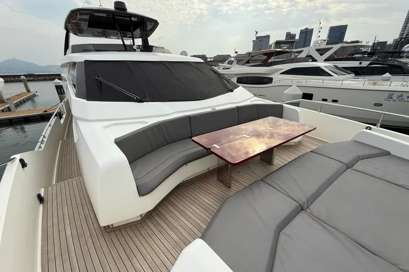 Ferretti 850 Yacht Photos Pics Luxurious 2017 Ferretti Yachts 850 with elegant deck seating and table, docked at marina.