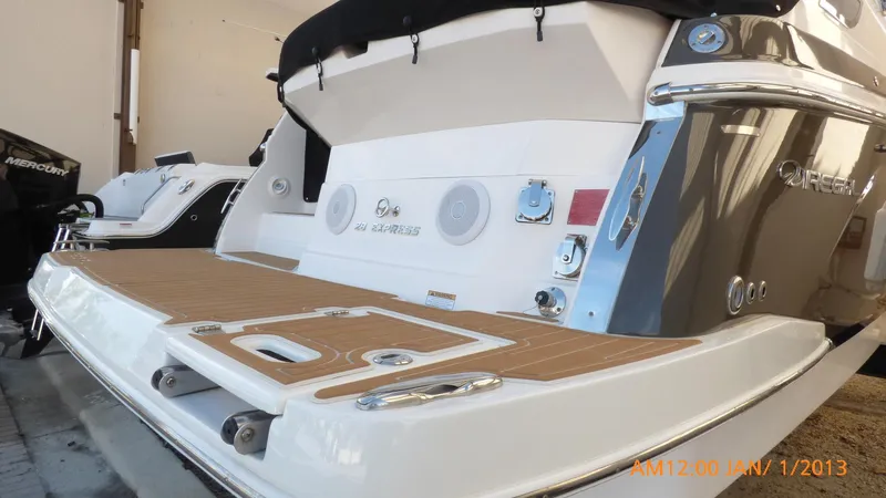  Yacht Photos Pics 2018 Regal 28 Express boat with teak swim platform and sleek design.