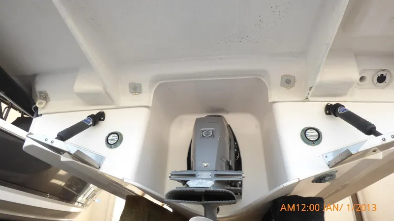  Yacht Photos Pics 2018 Regal 28 Express boat engine compartment, showing dual propellers and clean white interior.