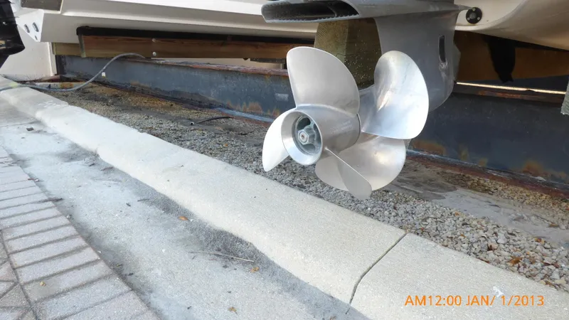  Yacht Photos Pics Close-up of a 2018 Regal 28 Express boat propeller on a trailer.