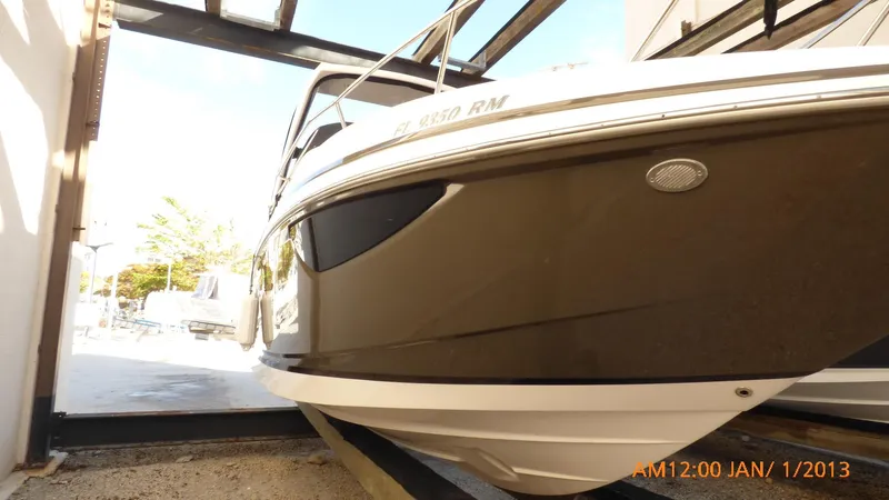  Yacht Photos Pics 2018 Regal 28 Express boat in storage, side view.