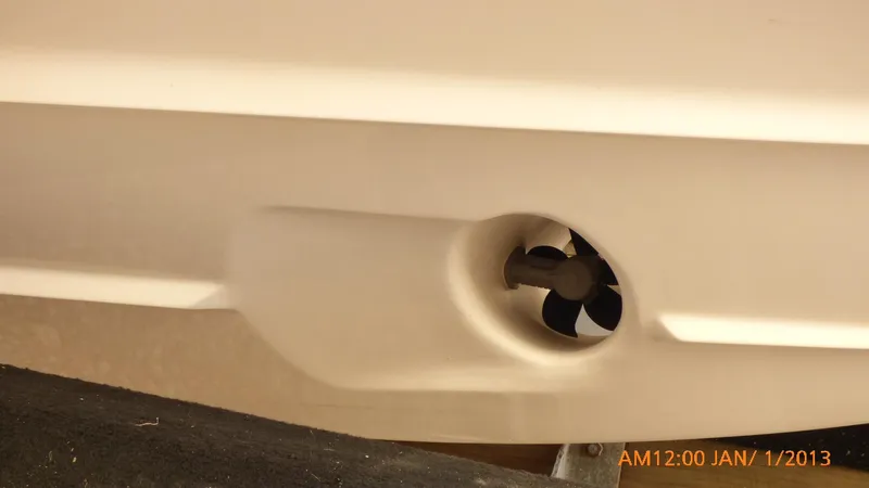 Yacht Photos Pics Close-up of a 2018 Regal 28 Express boat hull with propeller detail.