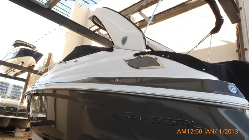  Yacht Photos Pics 2018 Regal 28 Express boat in storage, side view with cover.