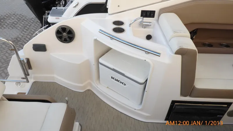  Yacht Photos Pics 2018 Regal 28 Express boat interior with seating, sink, and Igloo cooler.
