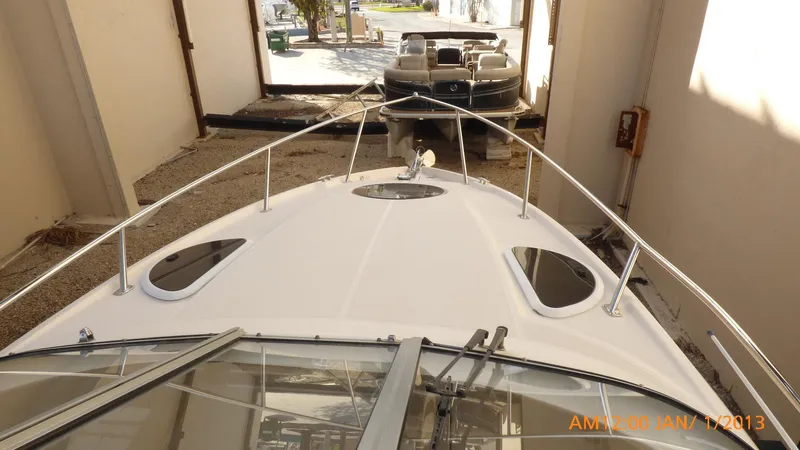  Yacht Photos Pics 2018 Regal 28 Express boat in storage, viewed from the bow.