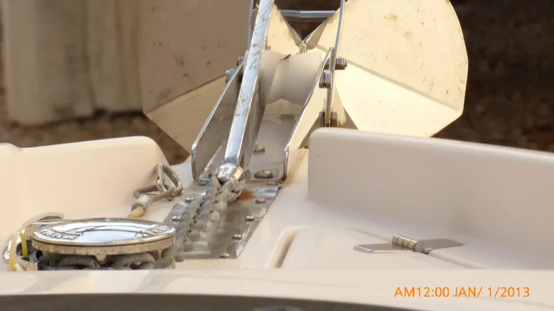  Yacht Photos Pics Close-up of 2018 Regal 28 Express boat anchor and chain mechanism.
