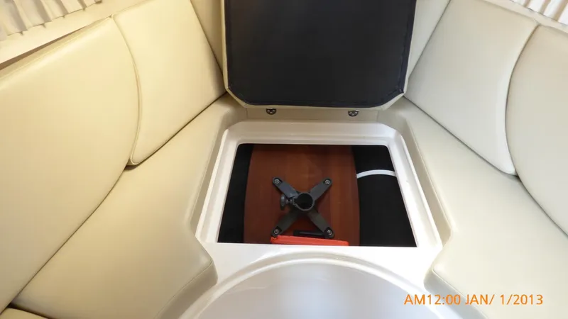  Yacht Photos Pics Interior of 2018 Regal 28 Express boat with storage compartment open.