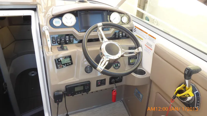  Yacht Photos Pics 2018 Regal 28 Express boat dashboard with steering wheel and control panel.