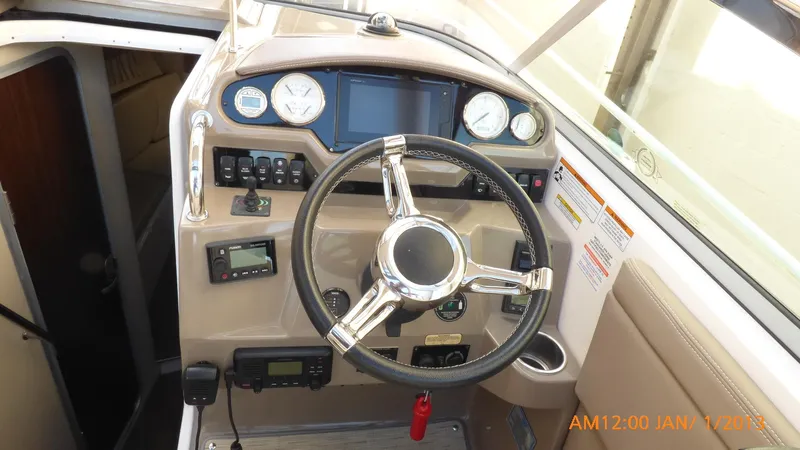  Yacht Photos Pics 2018 Regal 28 Express boat dashboard with steering wheel and control panel.