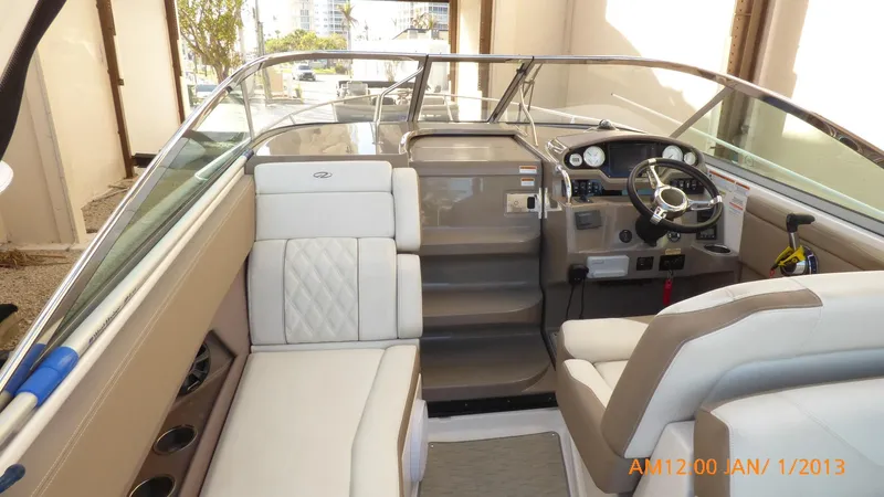  Yacht Photos Pics Interior of 2018 Regal 28 Express boat with beige seating and modern dashboard.