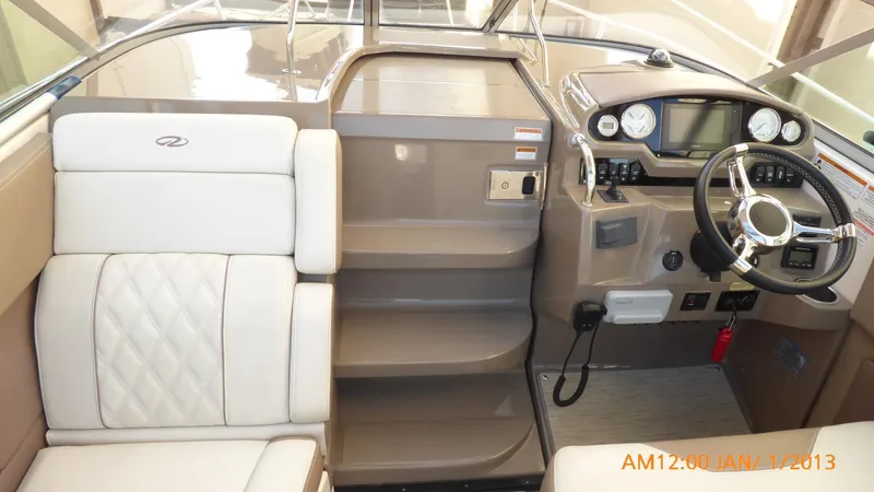  Yacht Photos Pics Interior of 2018 Regal 28 Express boat with steering wheel and seating.
