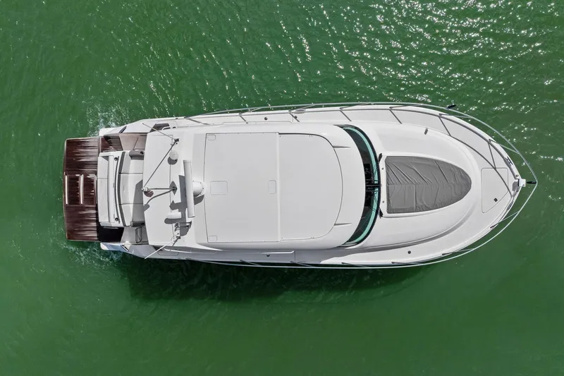 Southwind Yacht Photos Pics Overhead view of 2018 Tiara Yachts C44 Coupe on green water.