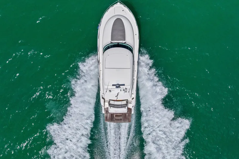 Southwind Yacht Photos Pics Aerial view of 2018 Tiara Yachts C44 Coupe cruising on turquoise water.