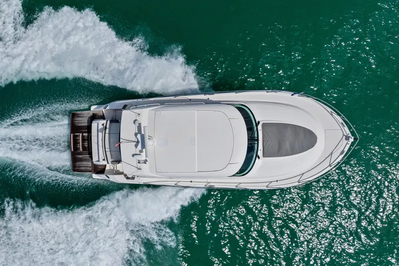 Southwind Yacht Photos Pics Aerial view of 2018 Tiara Yachts C44 Coupe cruising on turquoise water.